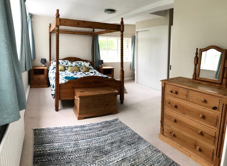 Master bedroom at Fell Foot with king-size four-poster bed